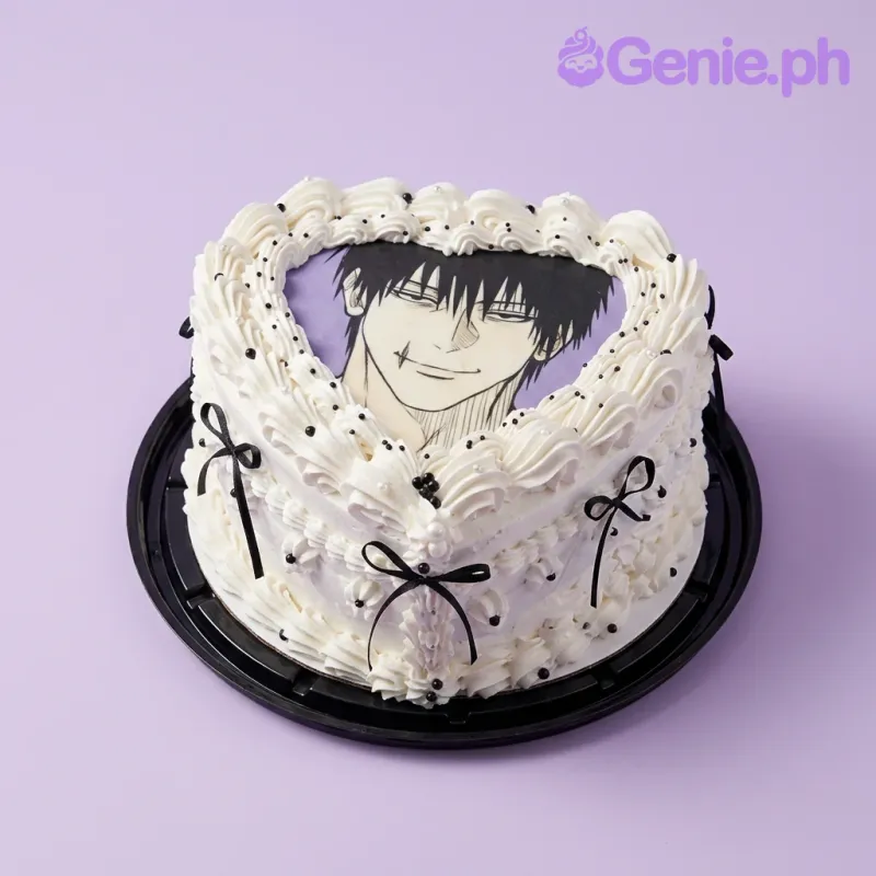 Heart-shaped white vintage cake with a printed anime character topper and black ribbon accents. Heart-shaped white vintage cake with a printed anime character topper and black ribbon accents.