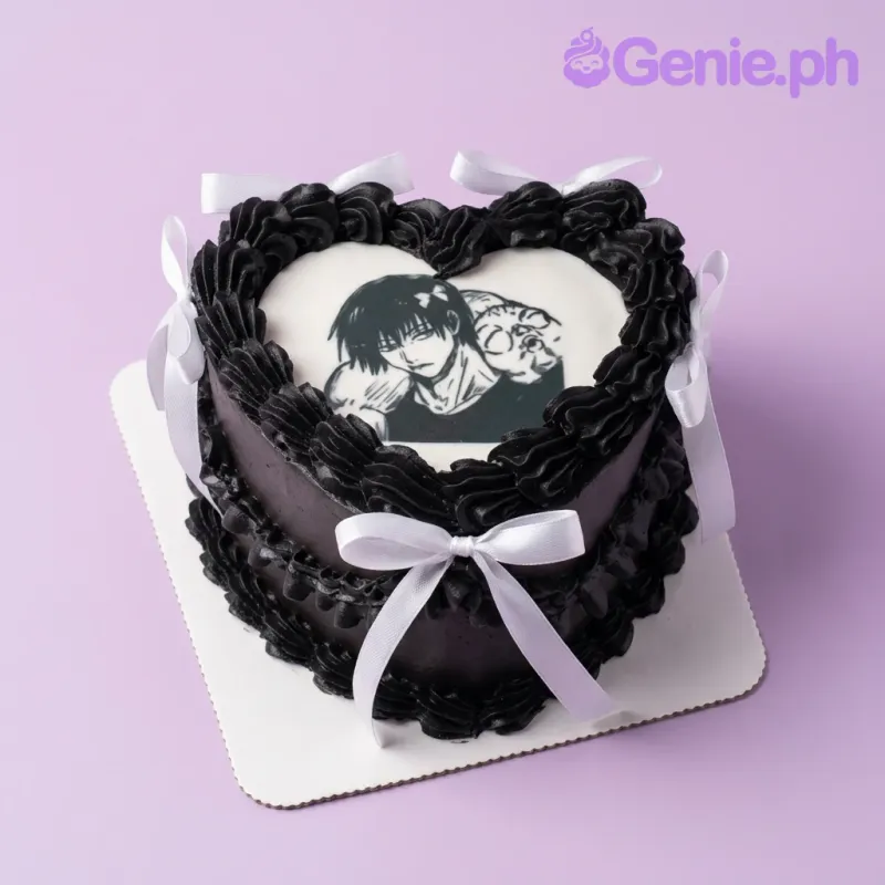 Black and white heart-shaped cake with a printed anime character topper and white ribbon bows. Black and white heart-shaped cake with a printed anime character topper and white ribbon bows.