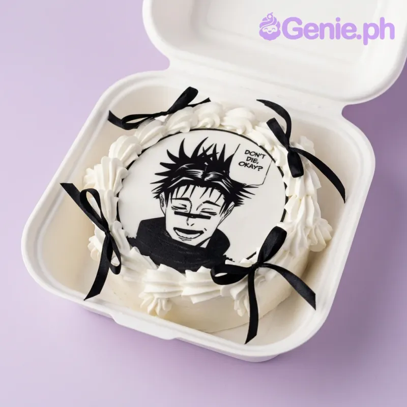 White single tier cake with black and white manga character printout and black satin ribbons White single tier cake with black and white manga character printout and black satin ribbons