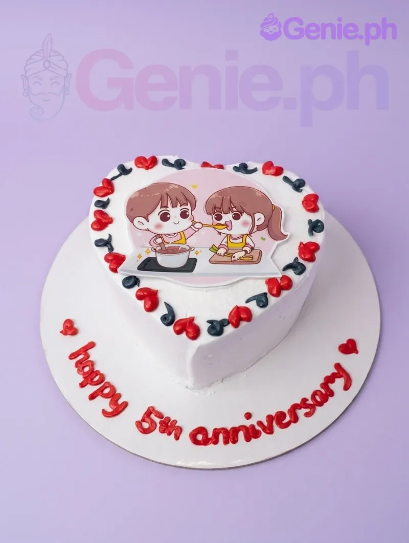 A white 1-tier Anniversary Heart cake, featuring a cartoon couple printout, red and navy blue icing hearts, and 'happy 5th anniversary' text. A white 1-tier Anniversary Heart cake, featuring a cartoon couple printout, red and navy blue icing hearts, and 'happy 5th anniversary' text.