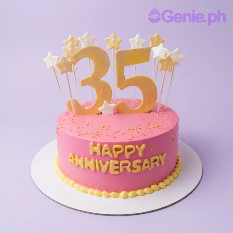A pink 1-tier cake themed around Anniversary, featuring a large gold number 35 topper, gold and white stars, and a yellow "HAPPY ANNIVERSARY" message. A pink 1-tier cake themed around Anniversary, featuring a large gold number 35 topper, gold and white stars, and a yellow "HAPPY ANNIVERSARY" message.
