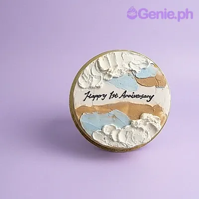 A white 1-tier cake with abstract blue and tan palette knife icing, featuring 'Happy 1st Anniversary' text. A white 1-tier cake with abstract blue and tan palette knife icing, featuring 'Happy 1st Anniversary' text.