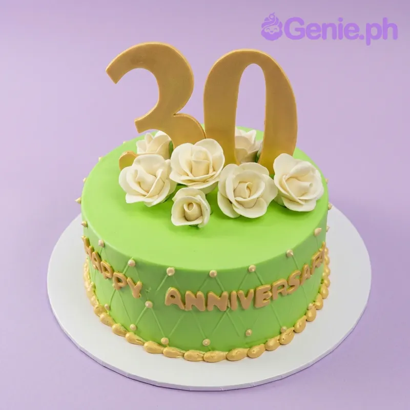 A green and white 1-tier cake themed for an anniversary, featuring a large gold number 30 topper, white gumpaste roses, and gold 'HAPPY ANNIVERSARY' text. A green and white 1-tier cake themed for an anniversary, featuring a large gold number 30 topper, white gumpaste roses, and gold 'HAPPY ANNIVERSARY' text.