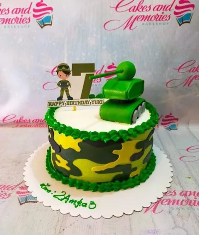 A camouflage 1-tier cake themed around Army, featuring a green tank, soldier, and number 7 printouts, with green icing borders. A camouflage 1-tier cake themed around Army, featuring a green tank, soldier, and number 7 printouts, with green icing borders.