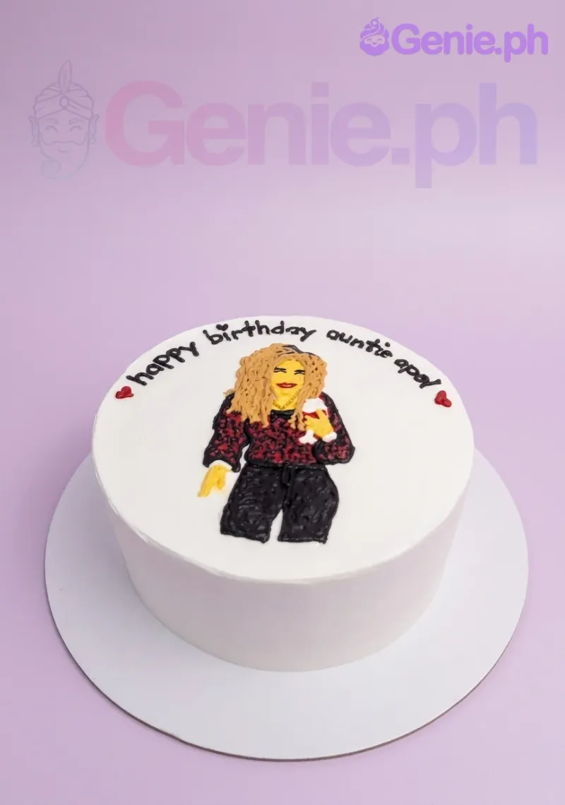 A white 1-tier cake themed for Auntie Apel's birthday, featuring a hand-piped woman with a wine glass and text. A white 1-tier cake themed for Auntie Apel's birthday, featuring a hand-piped woman with a wine glass and text.