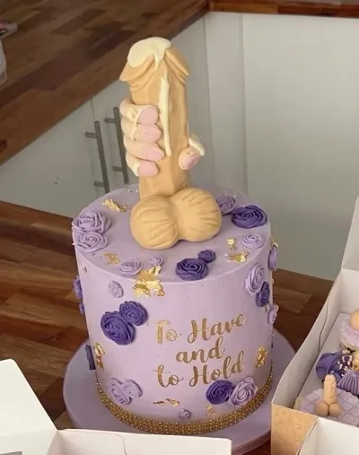 Lavender 1-tier cake with soft icing finish, a molded fondant novelty topper, and purple piped rosettes Lavender 1-tier cake with soft icing finish, a molded fondant novelty topper, and purple piped rosettes