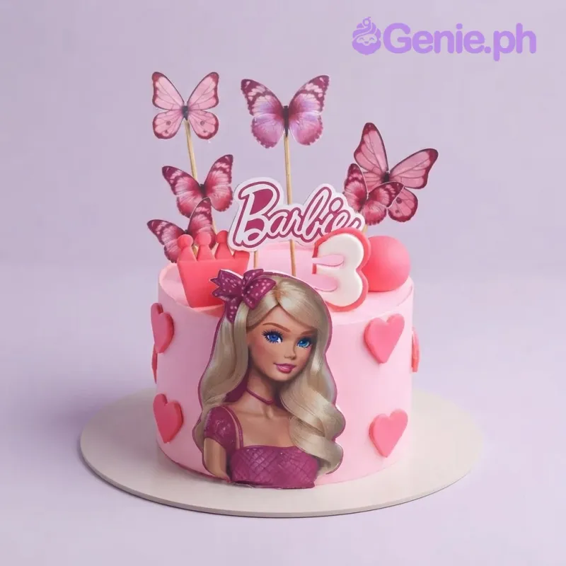Pink 1-tier birthday cake with Barbie printout topper, butterfly cutouts, and fondant heart decorations Pink 1-tier birthday cake with Barbie printout topper, butterfly cutouts, and fondant heart decorations