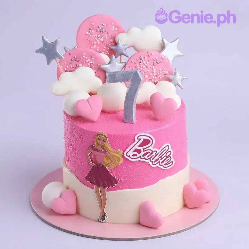 Pink and white 1-tier cake with Barbie character cutout, number 7 topper, and meringue pops Pink and white 1-tier cake with Barbie character cutout, number 7 topper, and meringue pops
