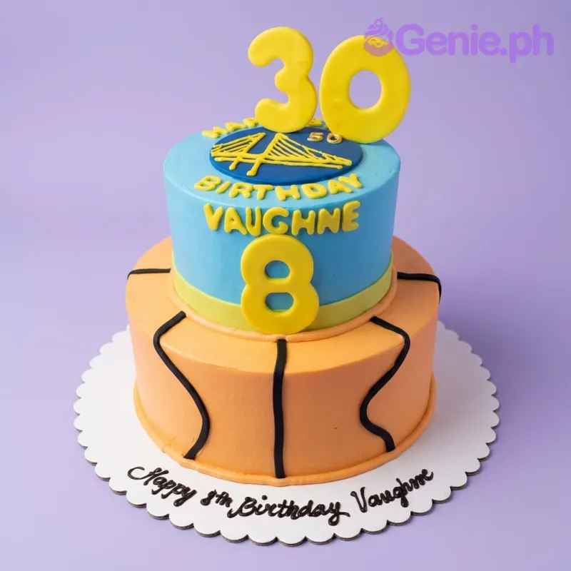 Two-tier Golden State Warriors basketball themed cake in blue and yellow with a bridge logo and number 30 topper. Two-tier Golden State Warriors basketball themed cake in blue and yellow with a bridge logo and number 30 topper.