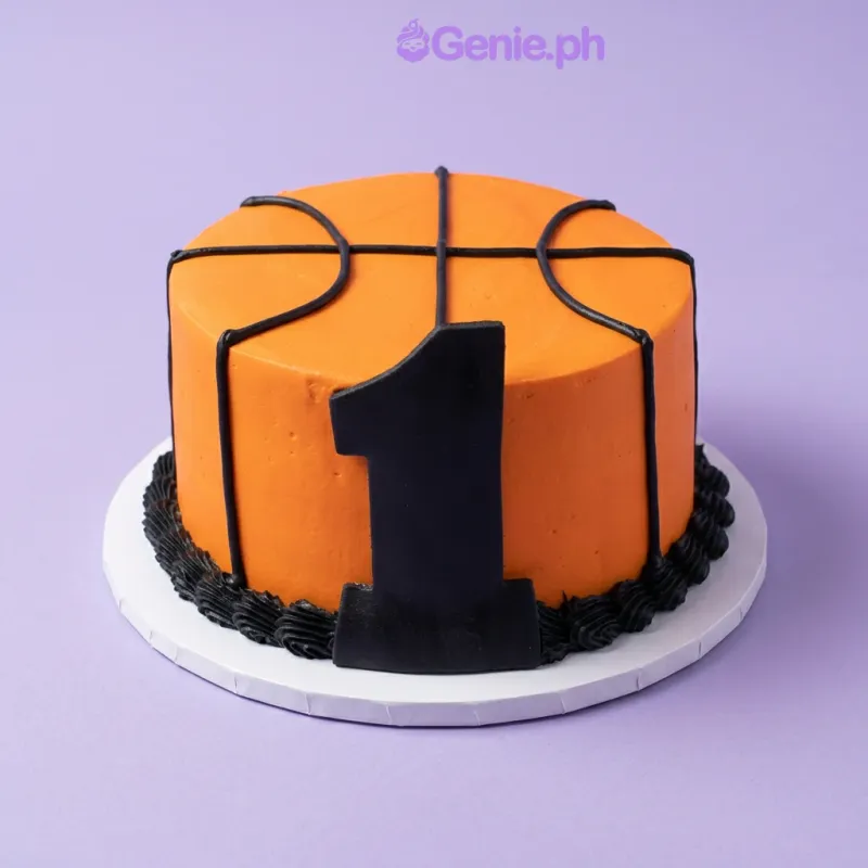 Orange basketball cake with black piped lines, a large black number one topper, and a black piped base border Orange basketball cake with black piped lines, a large black number one topper, and a black piped base border