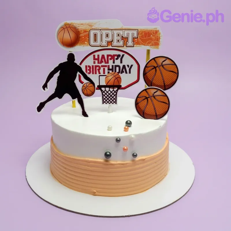 A white and orange 1 Tier cake themed around Basketball, featuring a silhouette player, basketballs, and a hoop topper. A white and orange 1 Tier cake themed around Basketball, featuring a silhouette player, basketballs, and a hoop topper.