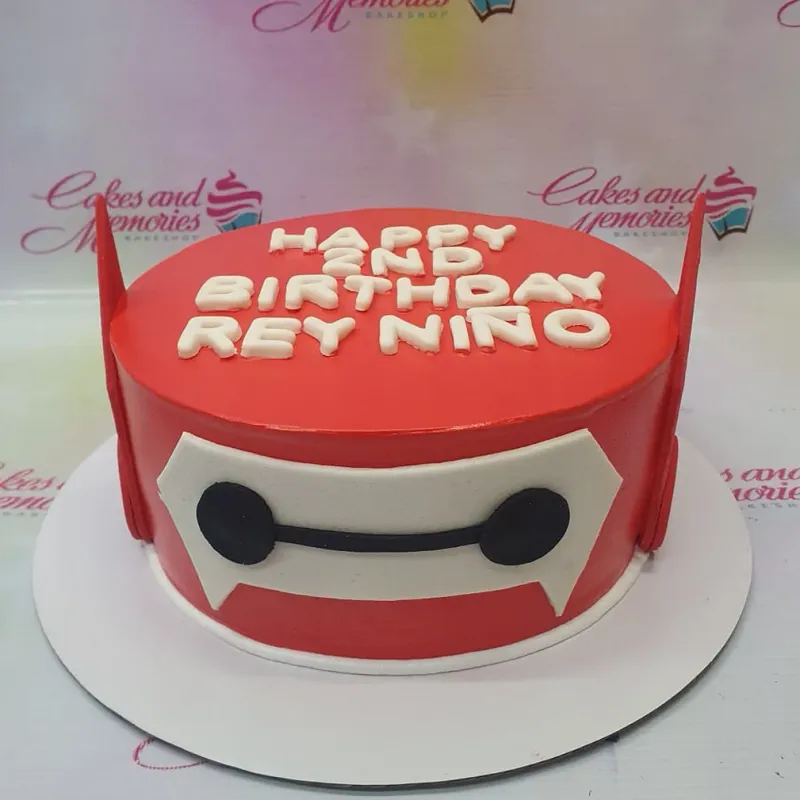 Red Baymax themed birthday cake with white fondant eyes and white gumpaste letters for Rey Nino's 2nd birthday. Red Baymax themed birthday cake with white fondant eyes and white gumpaste letters for Rey Nino's 2nd birthday.
