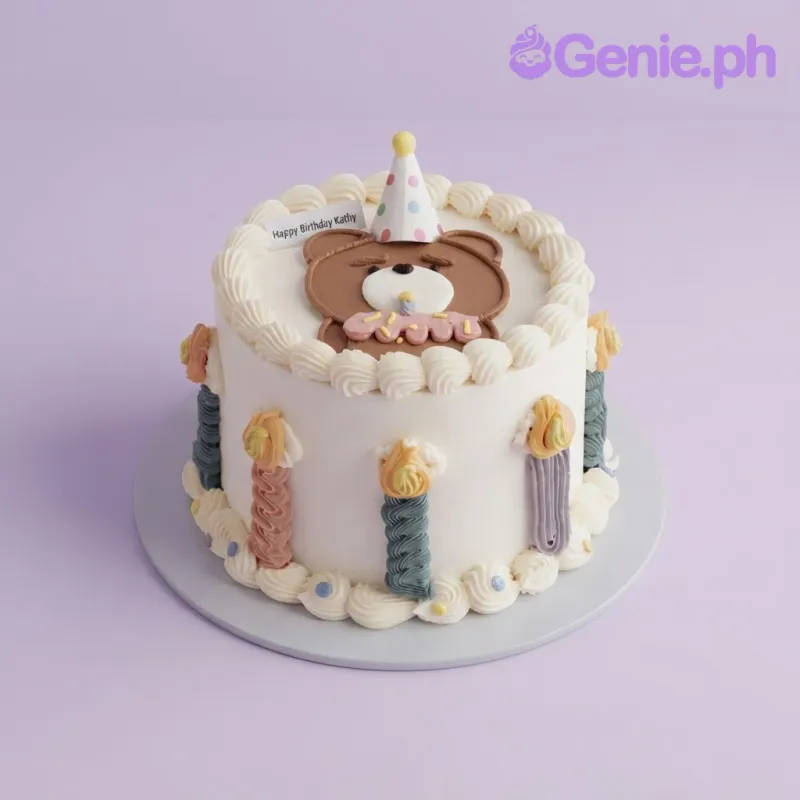 White 1-tier cake with soft icing, a flat brown bear face topper wearing a party hat, and piped icing candles on the side White 1-tier cake with soft icing, a flat brown bear face topper wearing a party hat, and piped icing candles on the side