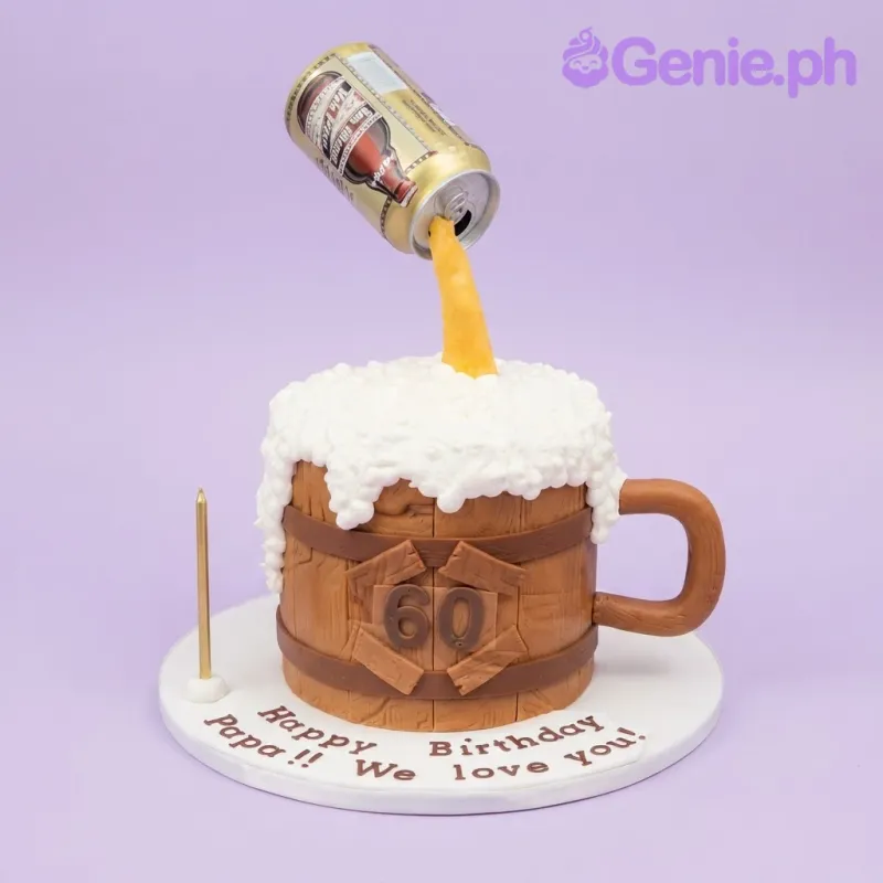Brown 1-tier fondant cake with wooden barrel side panels, a plastic beer can pouring liquid, and piped white icing beer foam Brown 1-tier fondant cake with wooden barrel side panels, a plastic beer can pouring liquid, and piped white icing beer foam