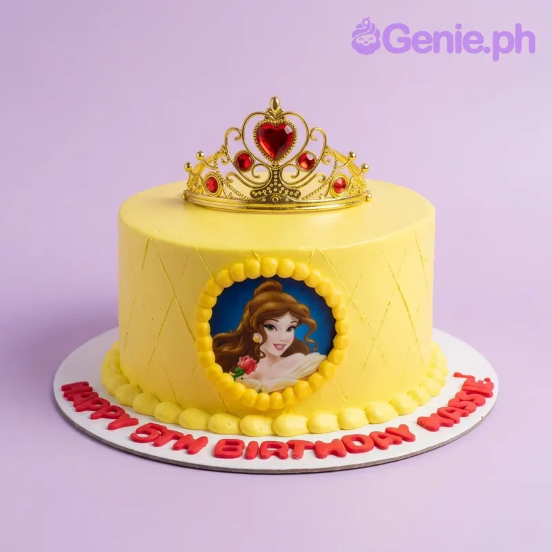 Yellow Belle princess themed birthday cake with a gold tiara and a printed character image on the side. Yellow Belle princess themed birthday cake with a gold tiara and a printed character image on the side.