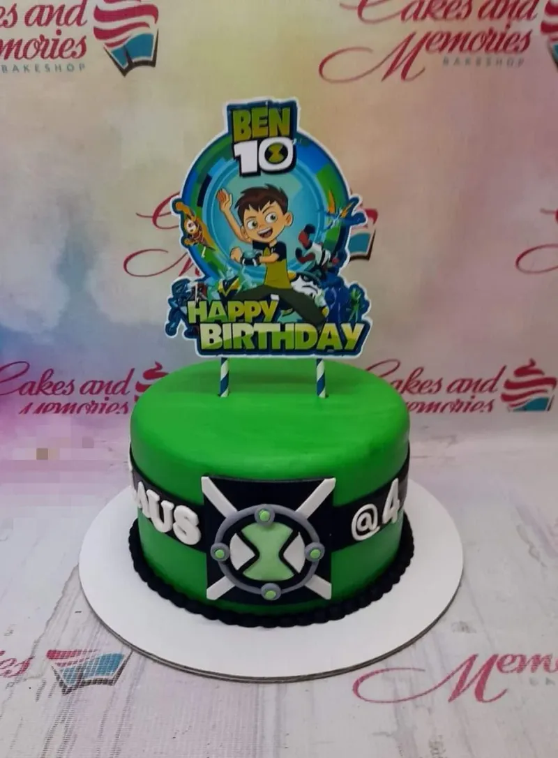 Green Ben 10 themed birthday cake with a large character printout topper and a black fondant band featuring the Omnitrix symbol. Green Ben 10 themed birthday cake with a large character printout topper and a black fondant band featuring the Omnitrix symbol.