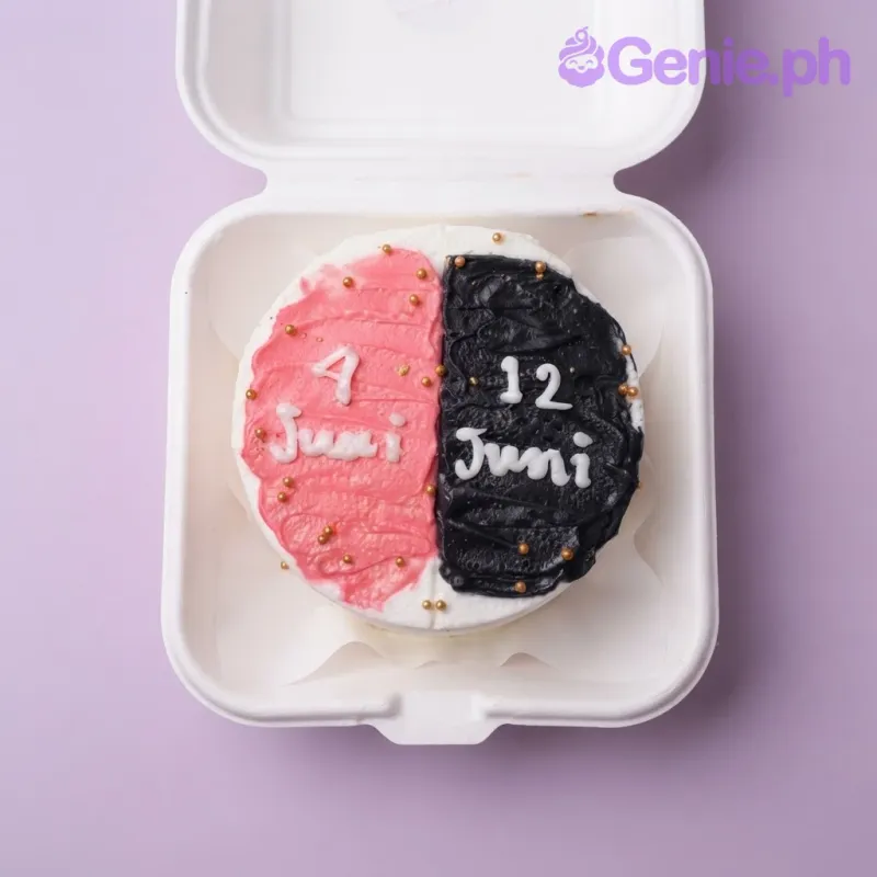 White bento cake with split red and black icing spread on top and piped white messages White bento cake with split red and black icing spread on top and piped white messages