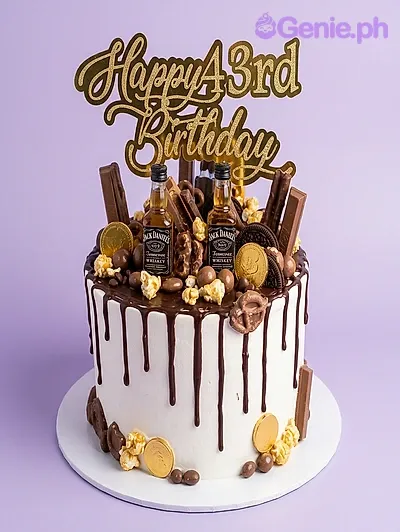 White 1-tier birthday cake with chocolate drip, miniature alcohol bottles, and chocolate candy toppings White 1-tier birthday cake with chocolate drip, miniature alcohol bottles, and chocolate candy toppings