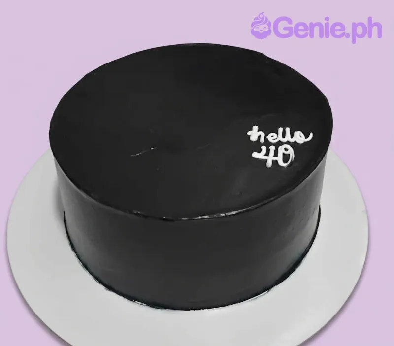 A black and white 1 Tier cake themed around minimalism, featuring a white piped 'hello 40' message and a white baseboard. A black and white 1 Tier cake themed around minimalism, featuring a white piped 'hello 40' message and a white baseboard.