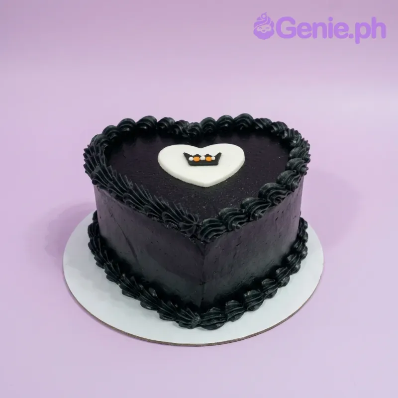 A black and white 1-tier heart-shaped minimalist cake, featuring a white heart topper with a black crown and black icing rosettes. A black and white 1-tier heart-shaped minimalist cake, featuring a white heart topper with a black crown and black icing rosettes.