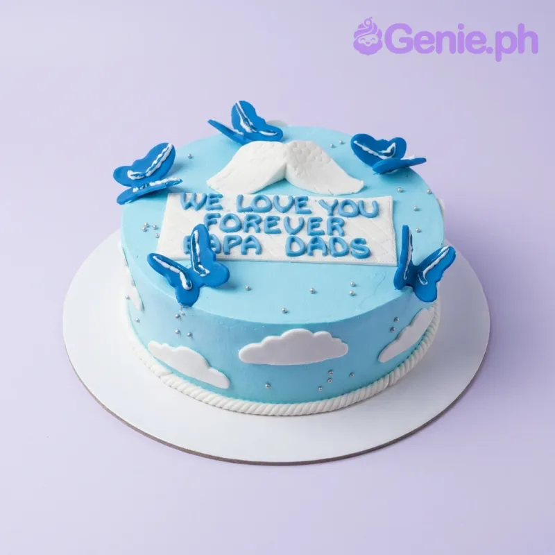Light blue 1-tier cake with blue butterflies, white angel wings, and silver dragees for a Papa Dads celebration. Light blue 1-tier cake with blue butterflies, white angel wings, and silver dragees for a Papa Dads celebration.