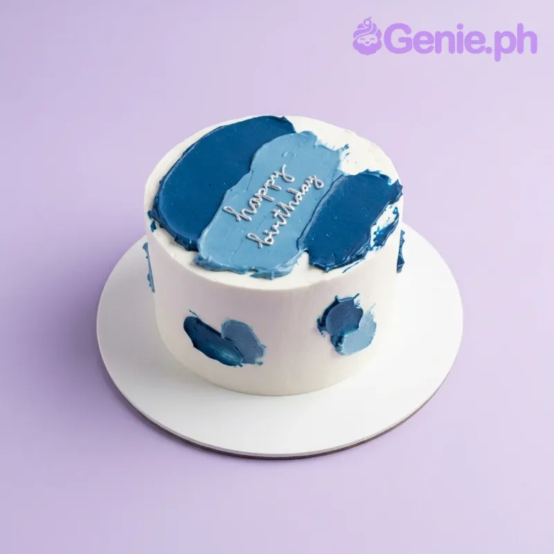 A white and navy blue 1-tier cake themed around Blue Minimalist, featuring navy palette knife icing and a white 'happy birthday' message. A white and navy blue 1-tier cake themed around Blue Minimalist, featuring navy palette knife icing and a white 'happy birthday' message.