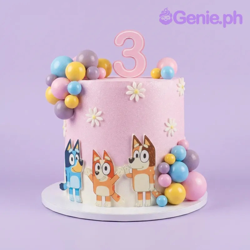 A pink 1 Tier Bluey-themed cake with glitter icing, Bluey and Bingo character cutouts, plastic spheres, and daisy accents. A pink 1 Tier Bluey-themed cake with glitter icing, Bluey and Bingo character cutouts, plastic spheres, and daisy accents.