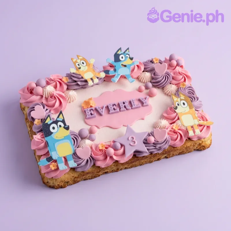A Bluey themed rectangle cake with rosettes, character printouts, a '3' star, and Everly's name. A Bluey themed rectangle cake with rosettes, character printouts, a '3' star, and Everly's name.