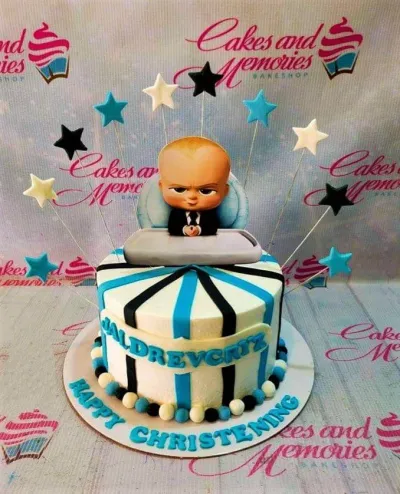 Boss Baby themed christening cake with blue and black stripes, star toppers, and a Boss Baby character cutout. Boss Baby themed christening cake with blue and black stripes, star toppers, and a Boss Baby character cutout.