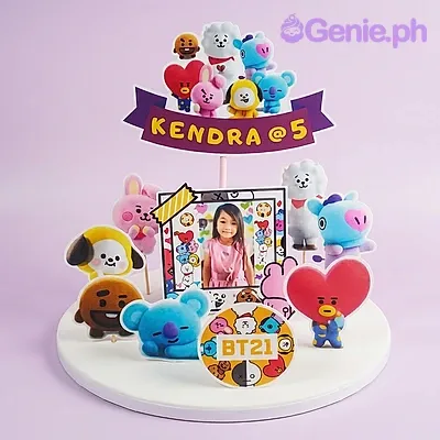 White 1-tier birthday cake with BT21 character toy toppers and a photo print White 1-tier birthday cake with BT21 character toy toppers and a photo print