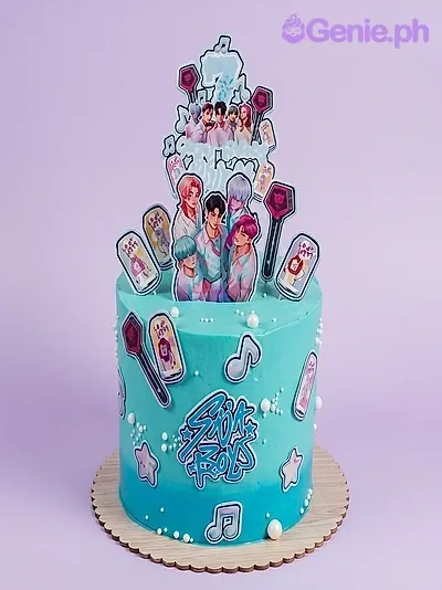 A teal and white 1-tier cake themed around BTS Kpop, featuring K-pop group members, lightsticks, musical notes, and 'Sana All' text. A teal and white 1-tier cake themed around BTS Kpop, featuring K-pop group members, lightsticks, musical notes, and 'Sana All' text.