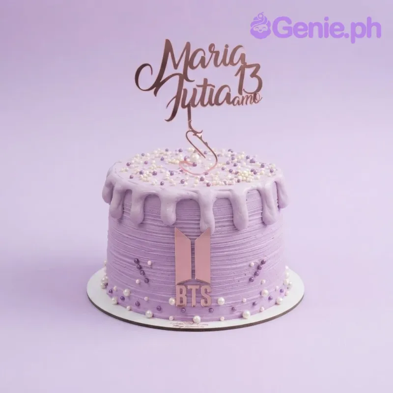 Soft lavender 1-tier cake with smooth icing, a cardstock name topper, and a BTS logo printout Soft lavender 1-tier cake with smooth icing, a cardstock name topper, and a BTS logo printout