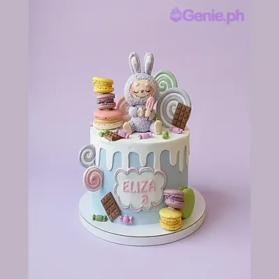 Light blue 1-tier cake with a lavender bunny topper, macarons, and chocolate bars Light blue 1-tier cake with a lavender bunny topper, macarons, and chocolate bars