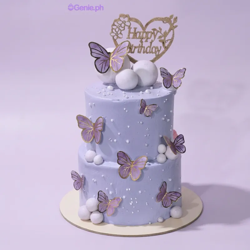 Lavender 2-tier cake with smooth soft icing, purple butterfly printouts, and fondant sphere accents Lavender 2-tier cake with smooth soft icing, purple butterfly printouts, and fondant sphere accents