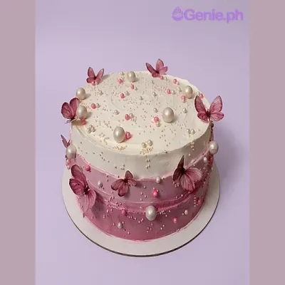 Pink and white gradient 1-tier cake with butterfly printouts and pearl dragees Pink and white gradient 1-tier cake with butterfly printouts and pearl dragees