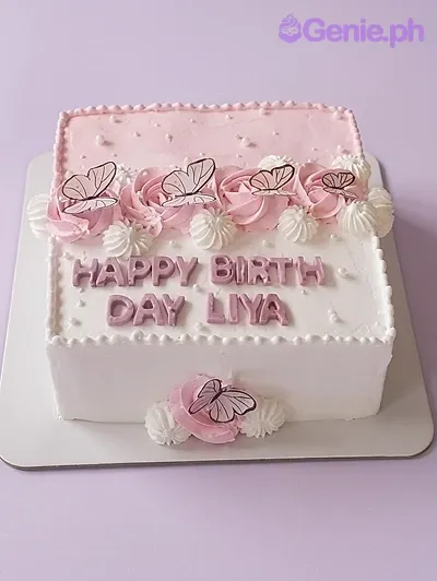 A white and pink square cake themed Butterfly Pink, featuring butterfly printouts, pink icing roses, and white meringue kisses. A white and pink square cake themed Butterfly Pink, featuring butterfly printouts, pink icing roses, and white meringue kisses.