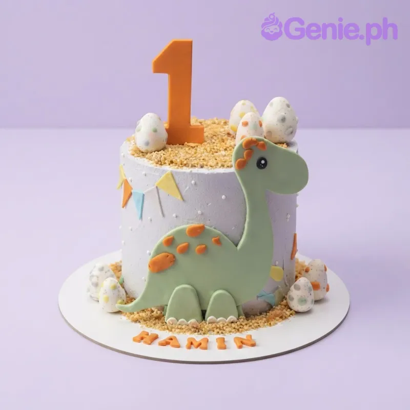 Light blue 1-tier birthday cake with smooth icing, a dinosaur plaque, number one topper, and molded eggs Light blue 1-tier birthday cake with smooth icing, a dinosaur plaque, number one topper, and molded eggs