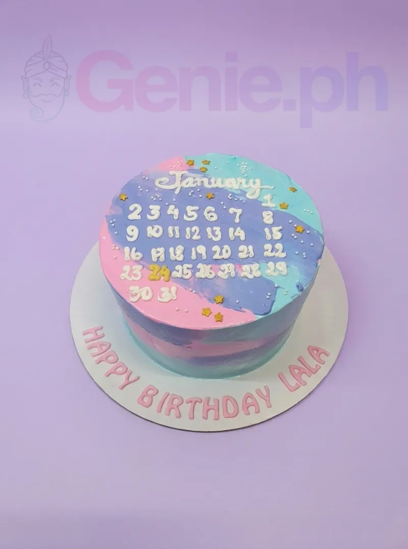 A pink, blue, and purple 1-tier calendar cake, featuring a white piped January calendar, a gold '24', and gold star accents. A pink, blue, and purple 1-tier calendar cake, featuring a white piped January calendar, a gold '24', and gold star accents.