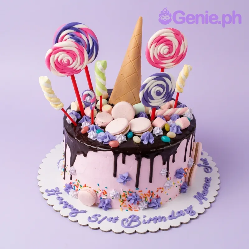 A pink and black 1-tier Candy Birthday cake, with an edible ice cream cone, colorful lollipops, macarons, marshmallows, and purple rosettes. A pink and black 1-tier Candy Birthday cake, with an edible ice cream cone, colorful lollipops, macarons, marshmallows, and purple rosettes.