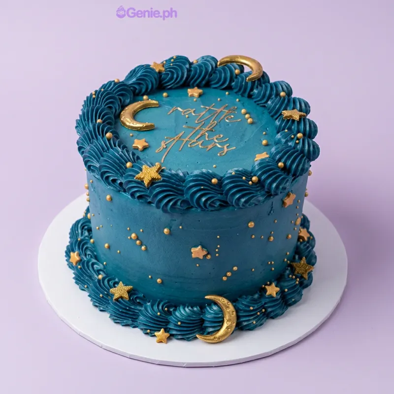 Navy blue 1-tier cake with soft icing, gold crescent moons, scattered gold stars, and a piped navy border Navy blue 1-tier cake with soft icing, gold crescent moons, scattered gold stars, and a piped navy border