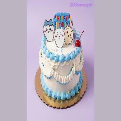 White 1-tier birthday cake with blue piped borders and cute character printout toppers White 1-tier birthday cake with blue piped borders and cute character printout toppers