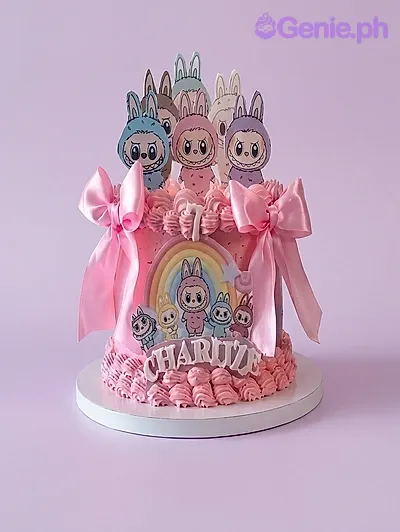 Pink 1-tier birthday cake with character printout toppers and pink satin bows Pink 1-tier birthday cake with character printout toppers and pink satin bows