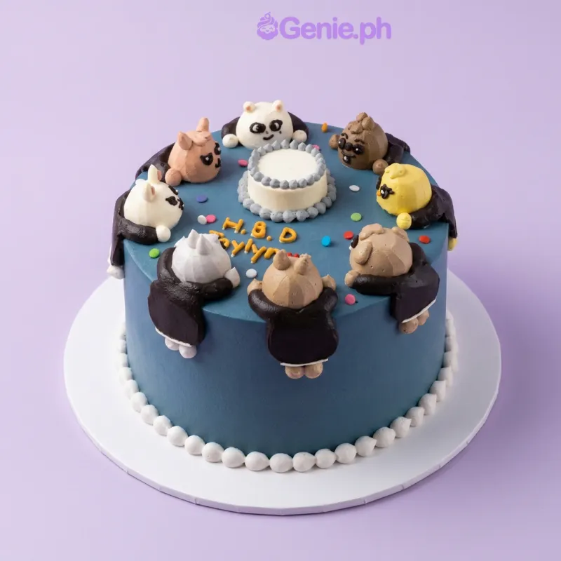 One tier sky blue cake with a small white cake topper, eight cute animal character figures, colorful confetti dots, and a piped white dot border One tier sky blue cake with a small white cake topper, eight cute animal character figures, colorful confetti dots, and a piped white dot border