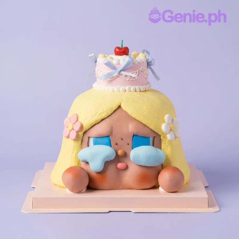 Yellow-haired girl head-shaped cake with a mini cake topper and flowers Yellow-haired girl head-shaped cake with a mini cake topper and flowers