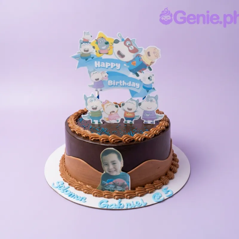 A brown 1 Tier cake themed around Character Chocolate, featuring character printouts, an edible boy photo, and brown rosettes. A brown 1 Tier cake themed around Character Chocolate, featuring character printouts, an edible boy photo, and brown rosettes.