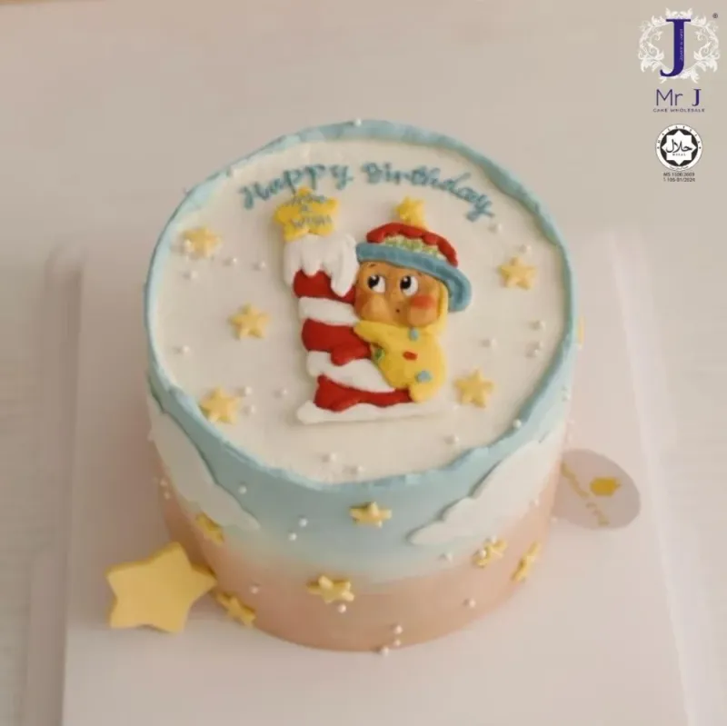 Light blue and peach gradient single tier cake with a 3D fondant character climbing a candy cane and yellow stars Light blue and peach gradient single tier cake with a 3D fondant character climbing a candy cane and yellow stars