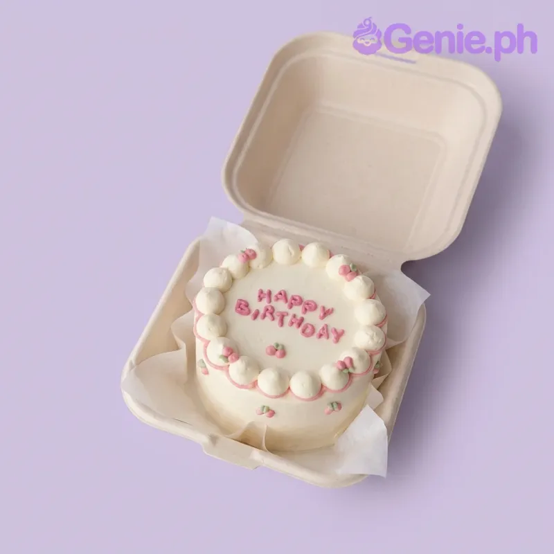 A white bento cake themed Cherry Minimalist, featuring pink piped borders, icing cherries, and a 'Happy Birthday' message. A white bento cake themed Cherry Minimalist, featuring pink piped borders, icing cherries, and a 'Happy Birthday' message.