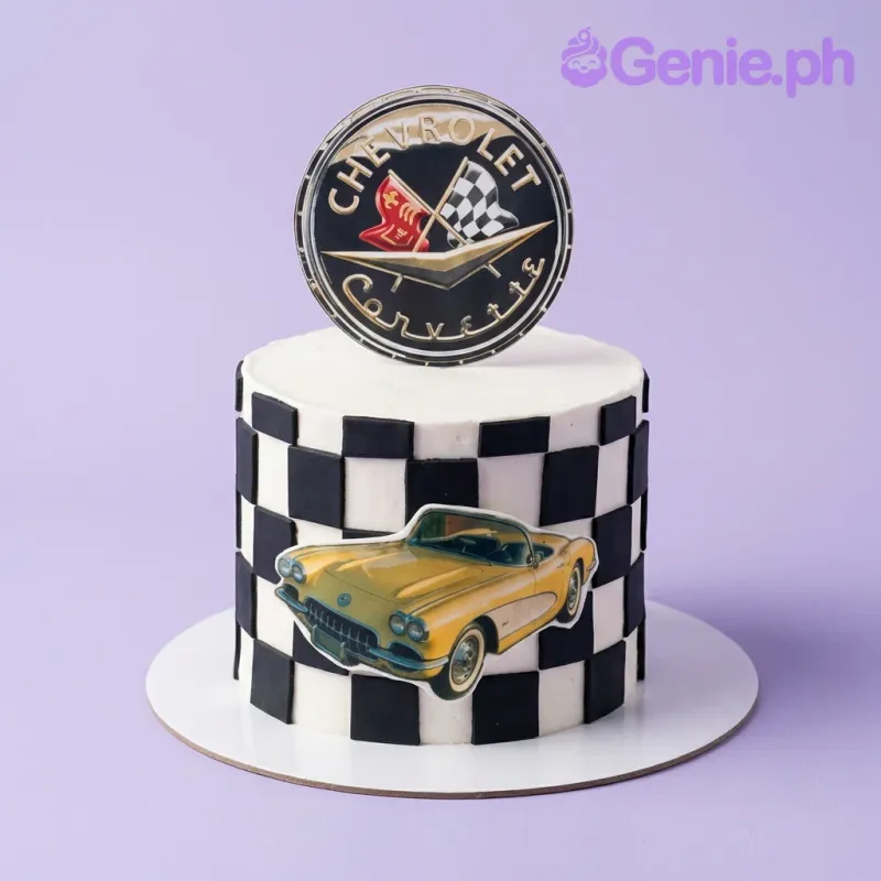 A white 1-tier Chevrolet Corvette cake with black and white checkered pattern, featuring a Chevrolet Corvette logo and a yellow car printout. A white 1-tier Chevrolet Corvette cake with black and white checkered pattern, featuring a Chevrolet Corvette logo and a yellow car printout.