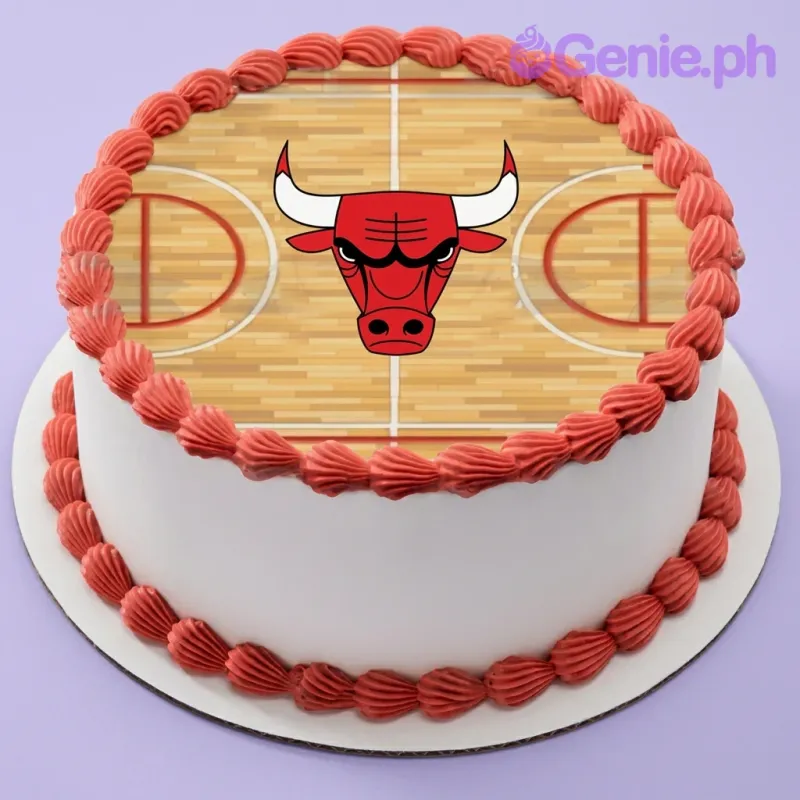 A white and red 1 Tier cake themed around Chicago Bulls basketball, featuring a team logo basketball court print and red icing borders. A white and red 1 Tier cake themed around Chicago Bulls basketball, featuring a team logo basketball court print and red icing borders.