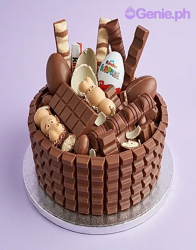 Chocolate 1-tier cake decorated with Kinder chocolate bars, Kinder Surprise egg, and Kinder Happy Hippo Chocolate 1-tier cake decorated with Kinder chocolate bars, Kinder Surprise egg, and Kinder Happy Hippo